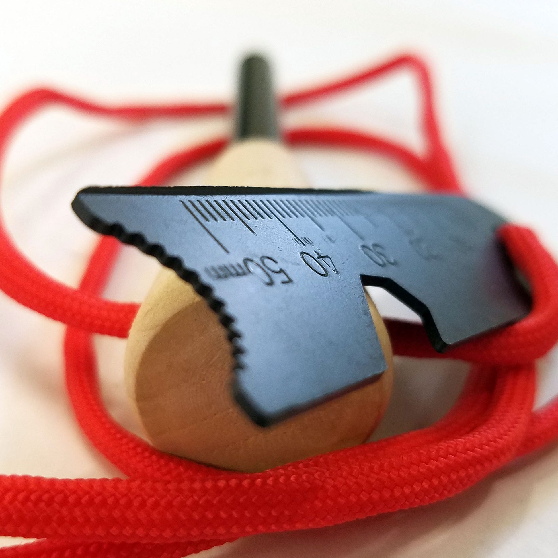 The FireStorm ferro rod includes a steel fire striker with enhanced edge