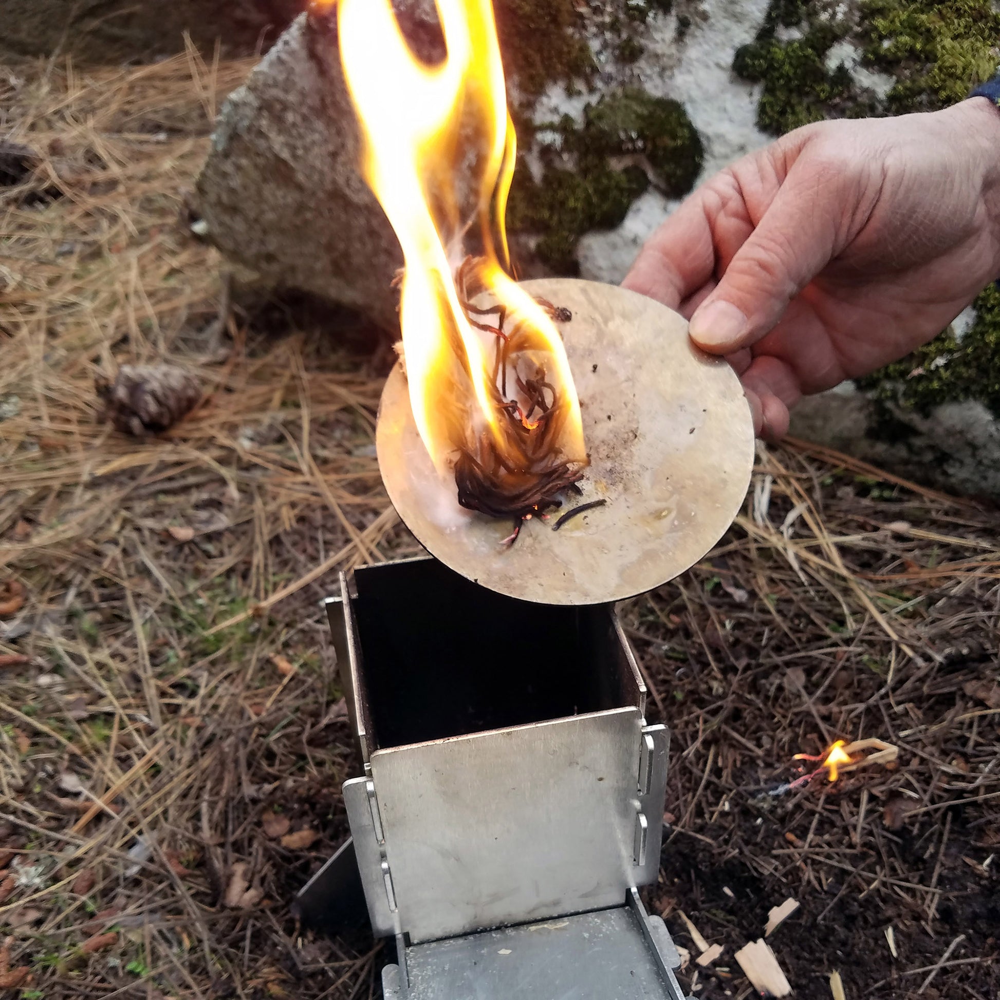 This flat pack twig rocket stove is great for camping, hiking, backpacking, hunting and wilderness survival.