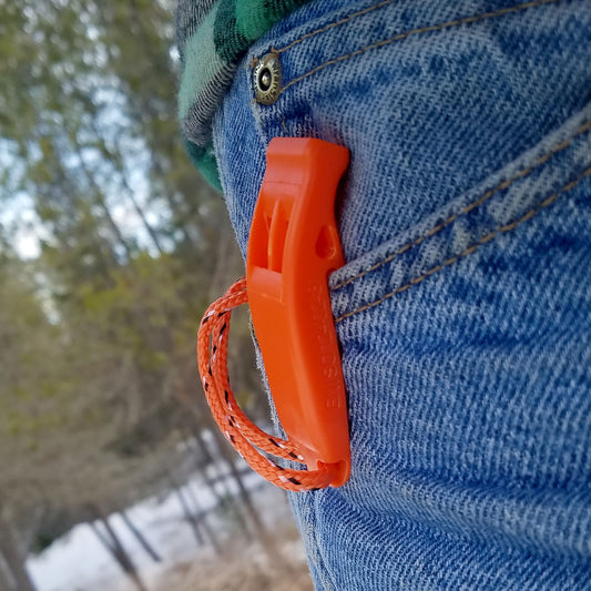 Orange clip-on signal whistle for Hiking